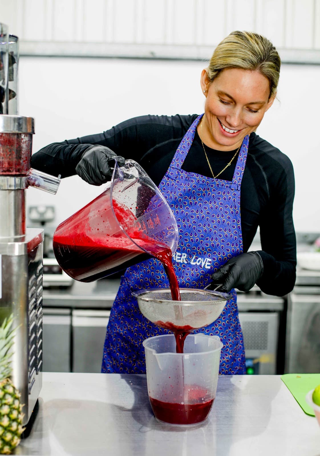 Tamaryn pouring freshly pressed juice