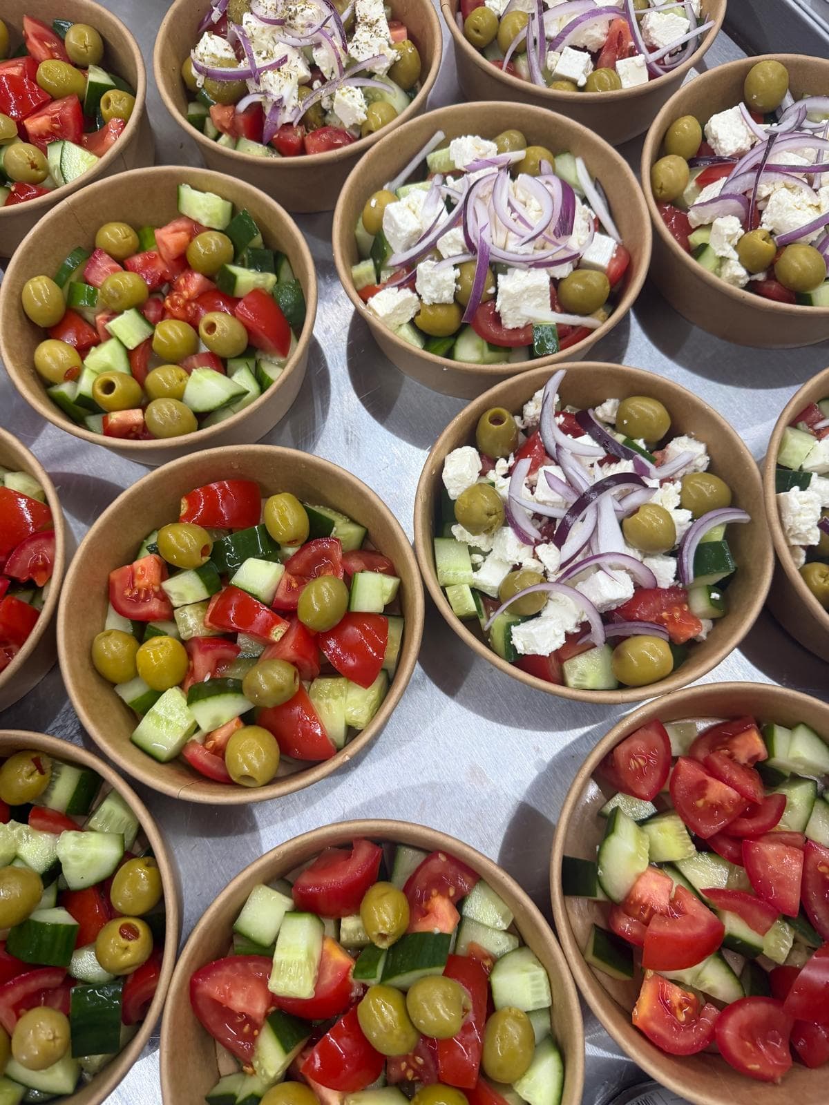 Greek salad bowls with feta, olives and tomato