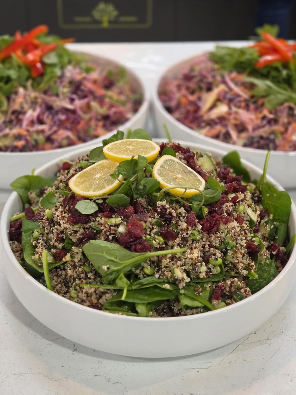 Quinoa salad with lemon in a white bowl
